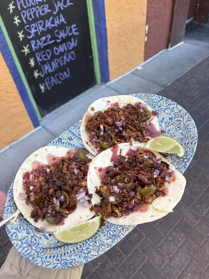 Tacos in front of the specials board